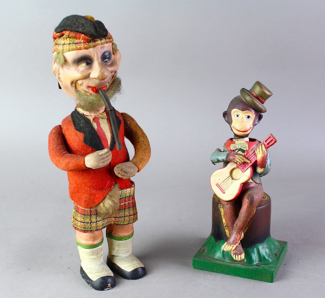 German Scotsman & Alps Japan Monkey Guitar Player: German Scotsman & Alps Japan Monkey Guitar Player Nodders. Both wind ups working, Monkey tilts head as he strums guitar. Tallest 10 1/4 inches.