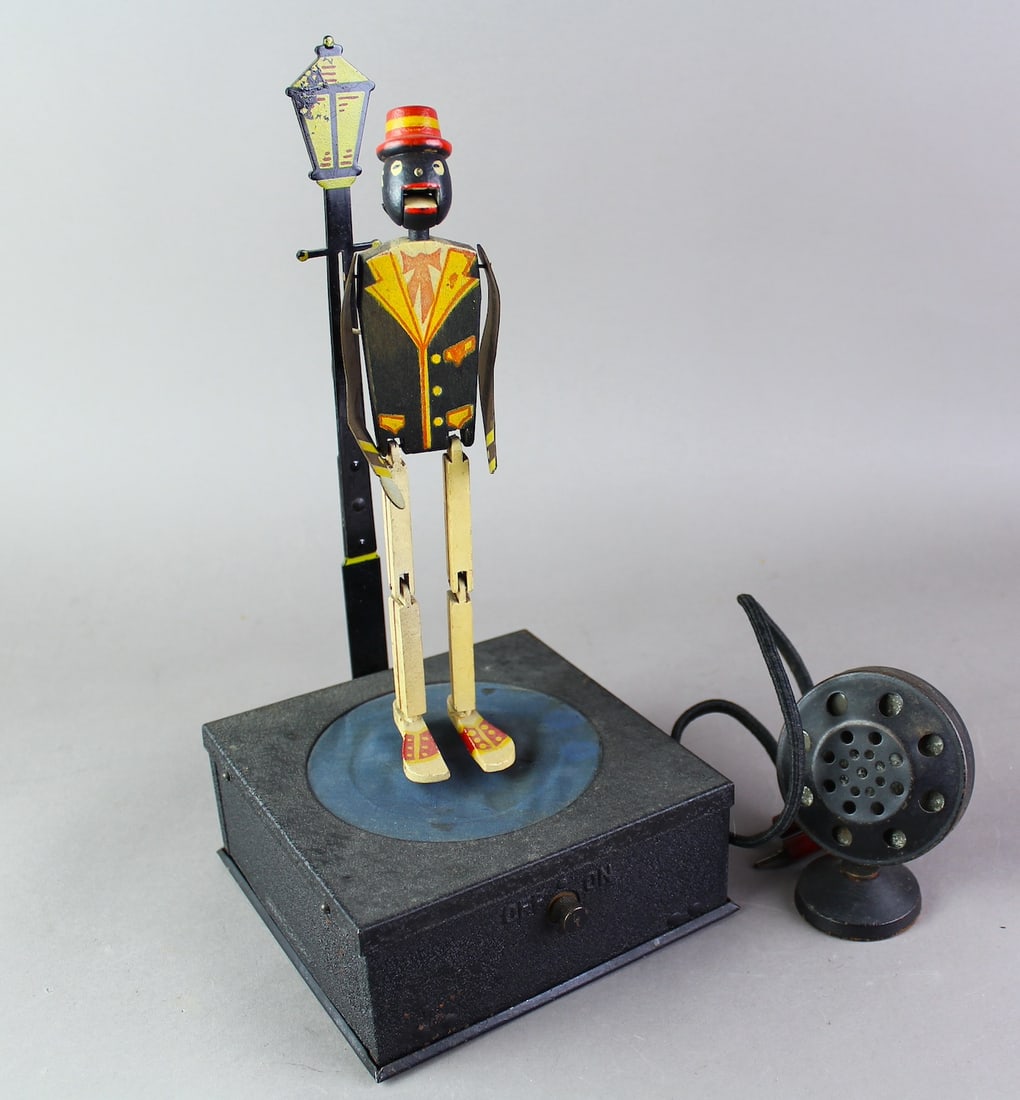 1930s National Black Memorabilia Radio Dancer: 1930s National Black Memorabilia Radio Dancer. Microphone activated dancing figure radio dancer. Appears to be in excellent condition. Update, 12 inches tall at the lamp.
