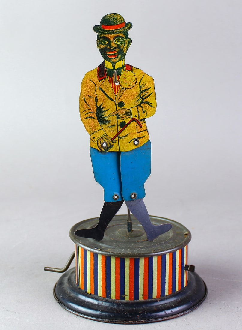 1930s German Tin Crank Black Memorabilia Wind Up Toy: 1930s German Tin Crank Wind Up Toy. Working tap dancer, dandy crank wind toy. Excellent litho, update- 8 1/2 inches tall.