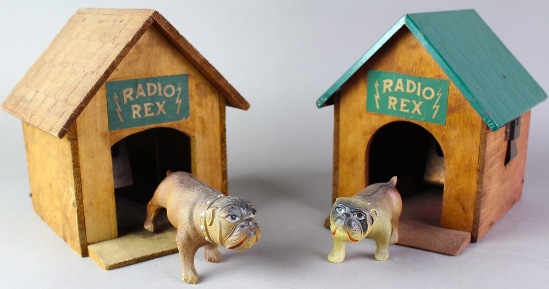 1930 Radio Rex Bulldog Shoots Out of Doghouse Pair: Two 1920s-1930s John Hugo MFG Co. New Haven CT Teletoy-1930s Radio Rex, Celluloid Bulldog in large dog house. Sound activated dog pops out of dog house. House is about 7 inches tall.