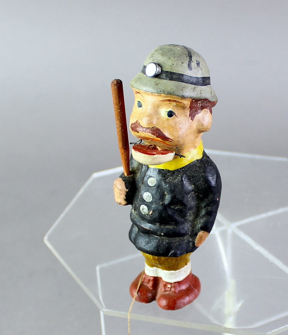 1920s German Composition Cop with Opening Mouth: 1920s German Composition Cop with Billy Club and Opening Mouth. Keystone style Cop pull string and mouth opens. About 4 inches tall.