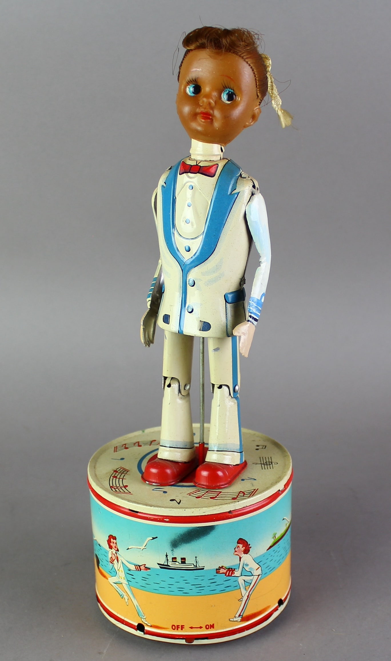Japan TIn Tap Dancing Navy Girl Scarce! Working Toy: Japan Tin Battery Op Tap Dancing Navy Girl Scarce! Working rare dancing tin toy with Naval Ship scenes and dancing sailor girl who is likely a rare African American female dancer toy.