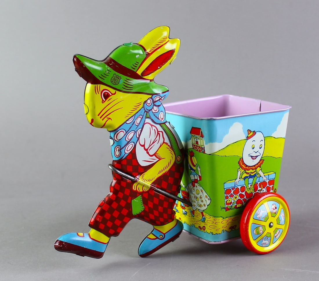 J. Chein Tin Peter Rabbit Cart: J. Chein Tin Peter Rabbit Cart with animated Nursery Rhymes around the car. Excellent condition 8 inches long.