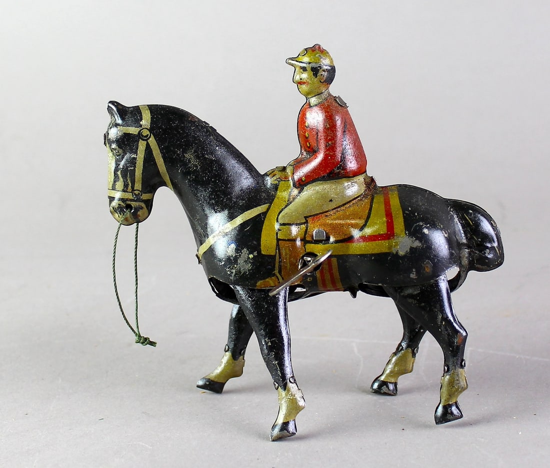 German Tin Walking Horse & Jockey: German Tin Walking Horse & Jockey. Probably Gunthermann, working wind up 6 inches.