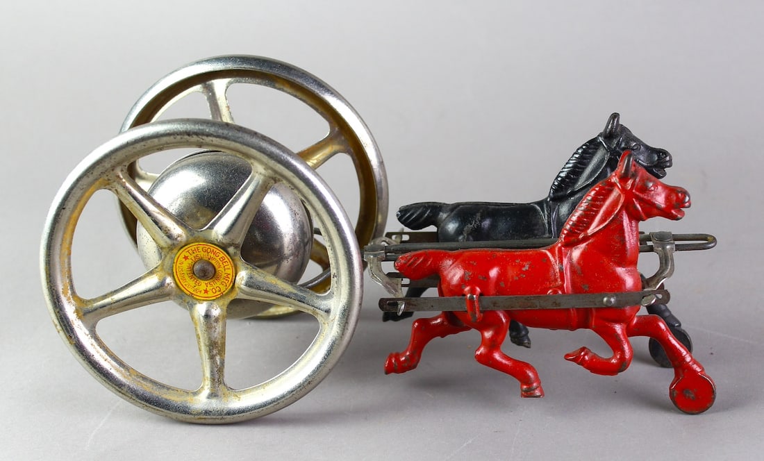 Gong Bell Toy 2 Horse Team Bell Toy: Gong Bell Toy of Conecticut 2 Horse Team Bell Toy. Cast Iron Horses pulling bell toy wheel.