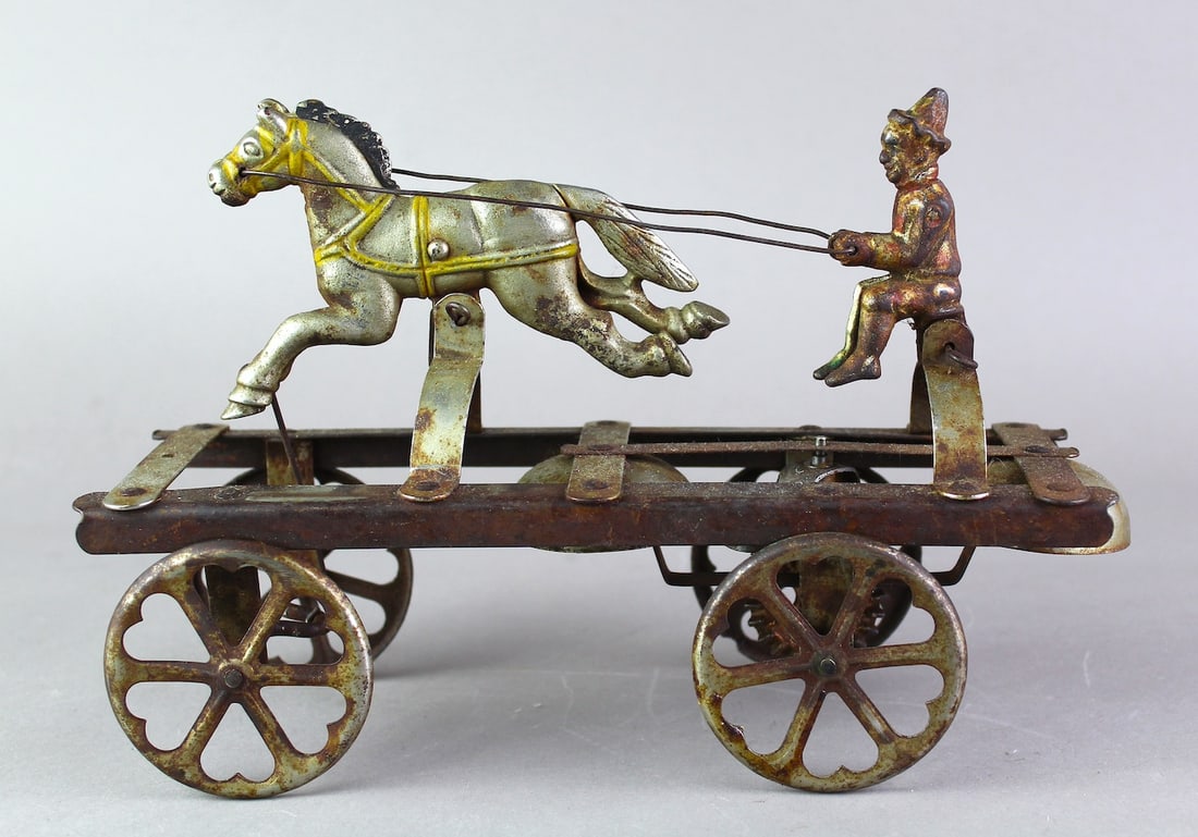 1900s Watrous Clown Horse Driven Bell Toy: 1900s Watrous Clown Horse Driven Bell Toy. 101/2 inches long original Bell Toy.