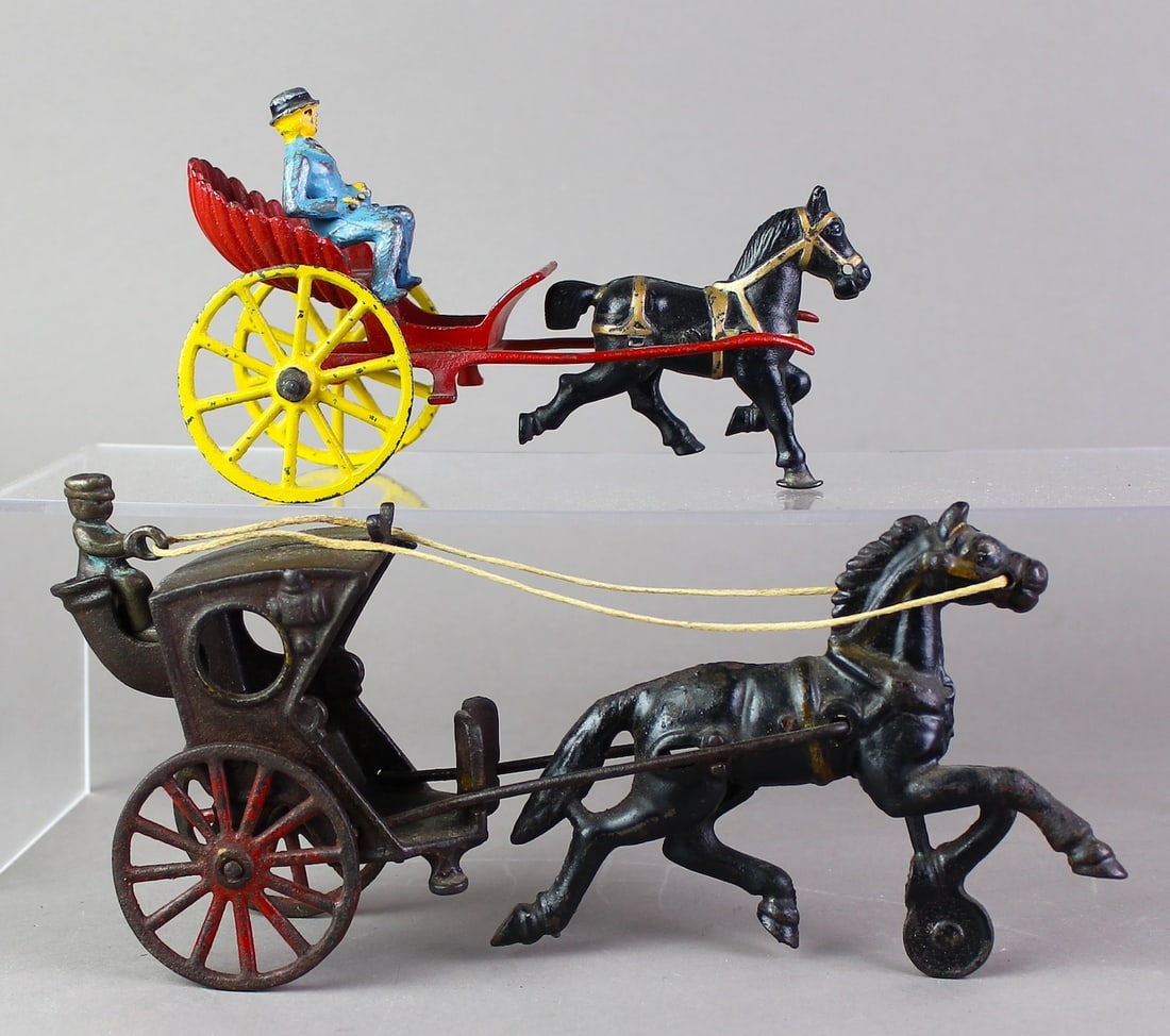 Hubley Hansom Cab & Hubley Horse Drawn Shell: Cast Iron Hubley Hansom Cab & Hubley Horse Drawn Shell with woman rider. Longest 10 inches.