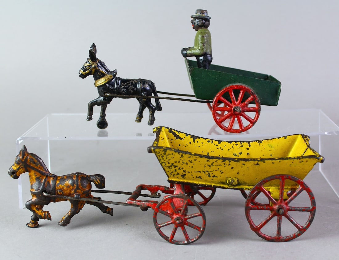 Cast Iron Wagon & Harris Donkey Cart: Cast Iron Wagon & Harris Donkey Cart (could be for foxy Grandpa). Original paint longest 10 inches.