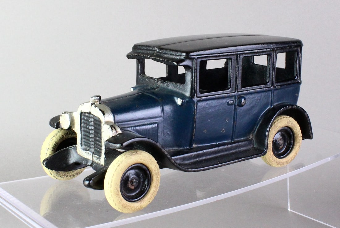 Arcade Cast Iron Chevy Sedan Town Car: Large Arcade Cast Iron Chevy Sedan. Beautifully proportioned Arcade sedan 8 1/4 inches in deep blue body with black hubs and roof. Professional restoration, great example.