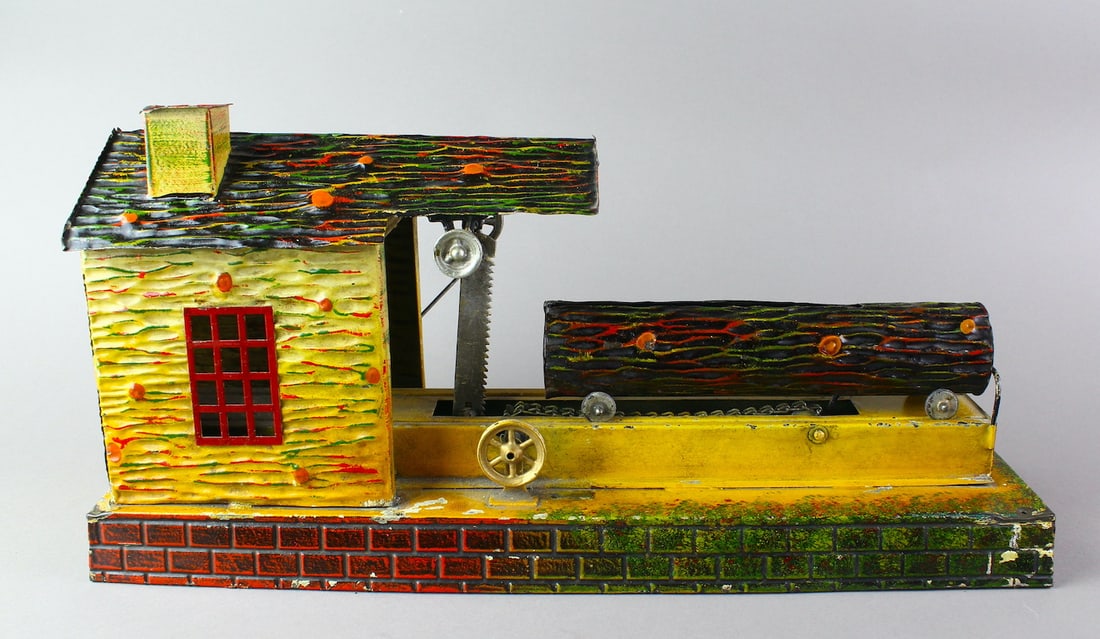 1920s German Tin Doll et Cie Log Mill Steam Toy: German Tin Doll et Cie Log Mill Steam Toy. Large working hand painted Germany tin steam/crank run log cutting mill. Beautiful detail, the log goes through the mill and is sawed with the moving cutter.