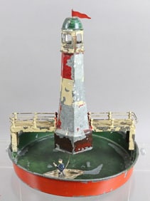 German Wind Up Tin Litho Lighthouse w Circling Boat