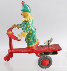 German Wind Up Tin Litho Clown On Scooter