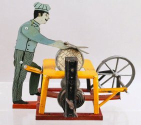 German Tin Clockwork Man At Grinding Wheel