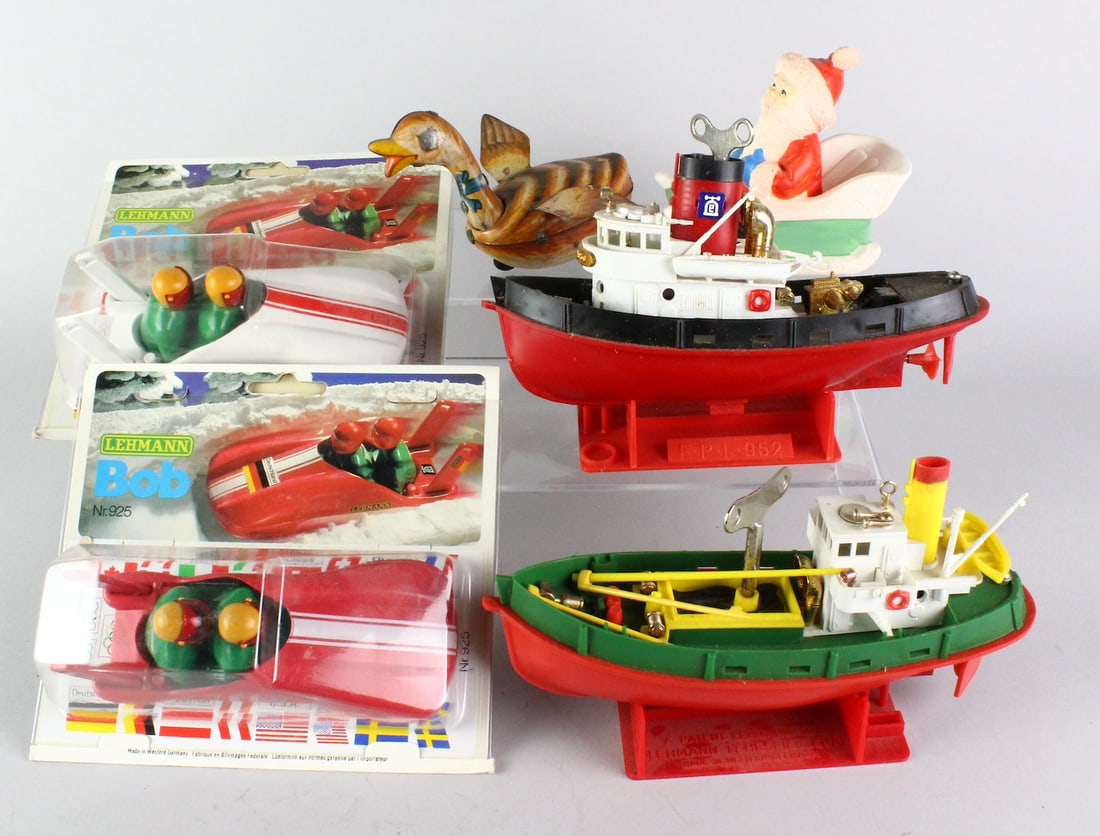 Lehmann Boats, Bob Sleds Mint in Package, Santa: Lehmann German toy Tug boats, Bob Sleds unopened in the package, wind up duck and Santa.