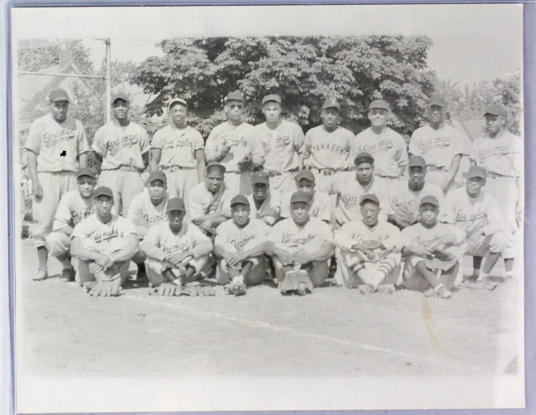 Negro League All-Stars Photograph: c.1950s Photo of Negro Players from different teams- the Triangles, Orange, and the Yankees. Appears to be old reprint photograph with players from multiple teams. 8 x 10 photo.