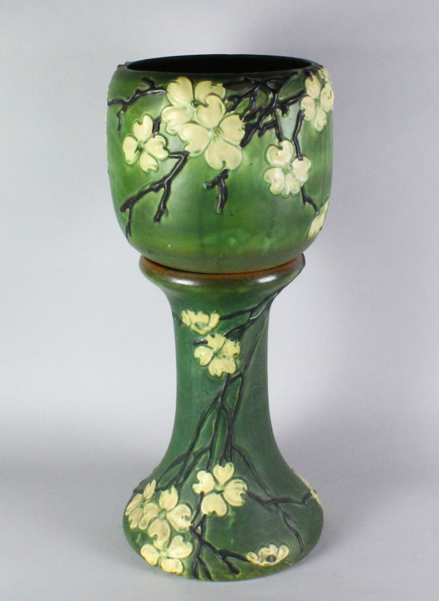 Roseville Art Pottery Dogwood Jardiniere & Pedestal: Roseville Art Pottery Dogwood Jardiniere & Pedestal. Dogwood II Jardiniere and Pedestal, Zanesville, Ohio, Introduced in 1928. Great molding and color. Tiny inside rim chip on jardiniere. 28.25 inches