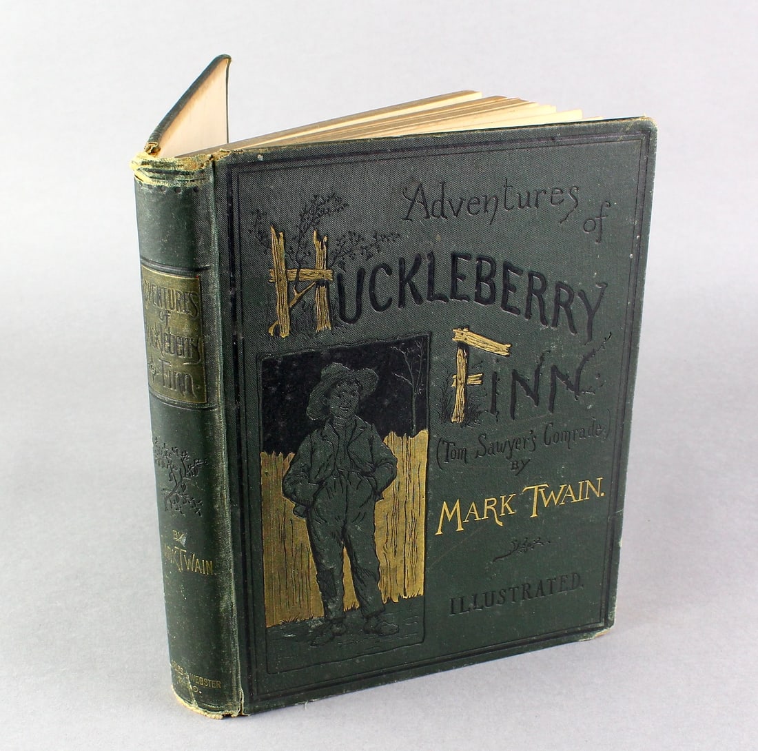 Mark Twain- The Adventures of Huckleberry Finn 1884 First Edition: Mark Twain. The Adventures of Huckleberry Finn (Tom Sawyer's Comrade). New York: Charles L. Webster and Company 1885. Solid copy with foxing on the title and copyright pages, wear to top of spine. Old