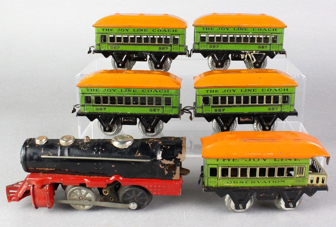 Marx Joy Line Tin Cars and Wind up Locomotive: Marx Joy Line Tin Cars 357 & 458 and Wind up Locomotive. Tin cars are near mint.