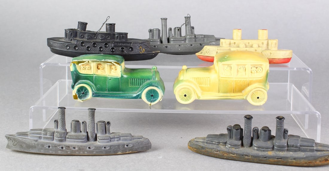 Celluloid Battleships and Cars: Celluloid/viscaloid Battleships and Cars. Unusual ships and 2 1920s sedans. Green sedan has some damage but great detail of people in the windows. Longest 5 inches. Ships are rare to find in Celluloid
