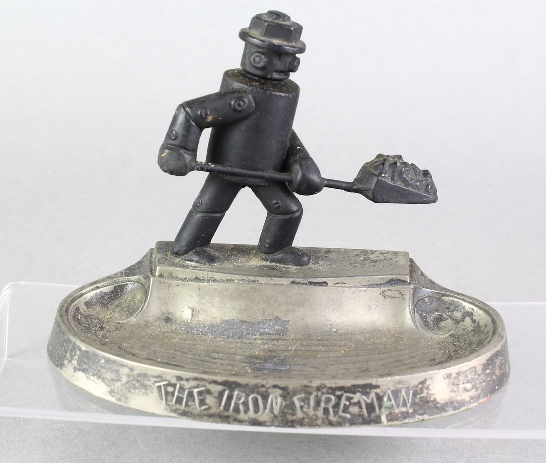 Robot Iron Fireman Desk Promo: Robot Iron Fireman Desk Promo. Robot shovels coal on this metal robot promotional piece.