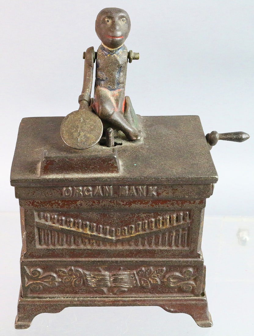 Cast Iron Organ Bank Keyser & Rex: Cast Iron Organ Bank Keyser & Rex 7 inches missing one arm and trap cover.