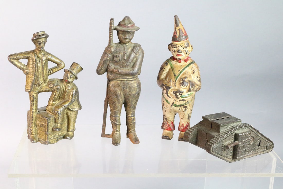Cast Iron Figural Bank Lot: A.C. Williams etc. Cast Iron Figural Bank Lot- Mutt & Jeff, Clown, WWI Tank, 5,6 inches.