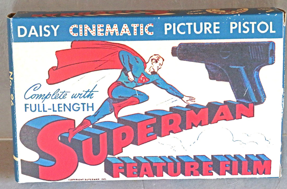 Daisy Cinematic Picture Pistol in Box No 96: Daisy Cinematic Picture Pistol in Box No 96, box is crisp EX+, pistol has some surface rust spots, box appears to be a high quality reproduction.