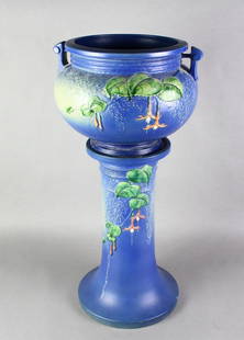 Roseville Fuschia Jardiniere & Pedestal: Roseville Fuschia Jardiniere & Pedestal 25 1/2 inches tall. Rich blue/purple color. Tiny flea bite at bottom of base.