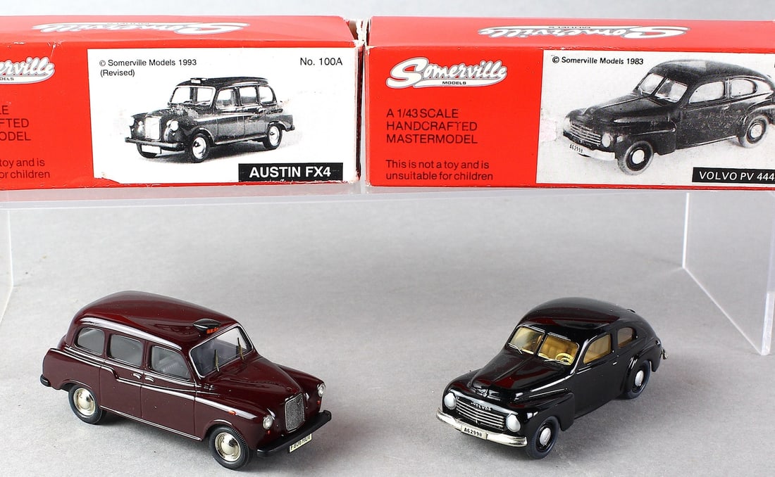 Diecast Somerville Austin & Volvo in Box: Diecast Somerville Austin FX4 & Volvo PV444 in Box. NM diecast cars in box. Handcrafted in England.