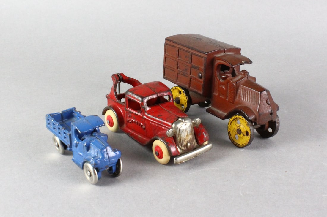 Arcade Plymouth Wrecker, & Cast Iron Trucks (1 of 4)