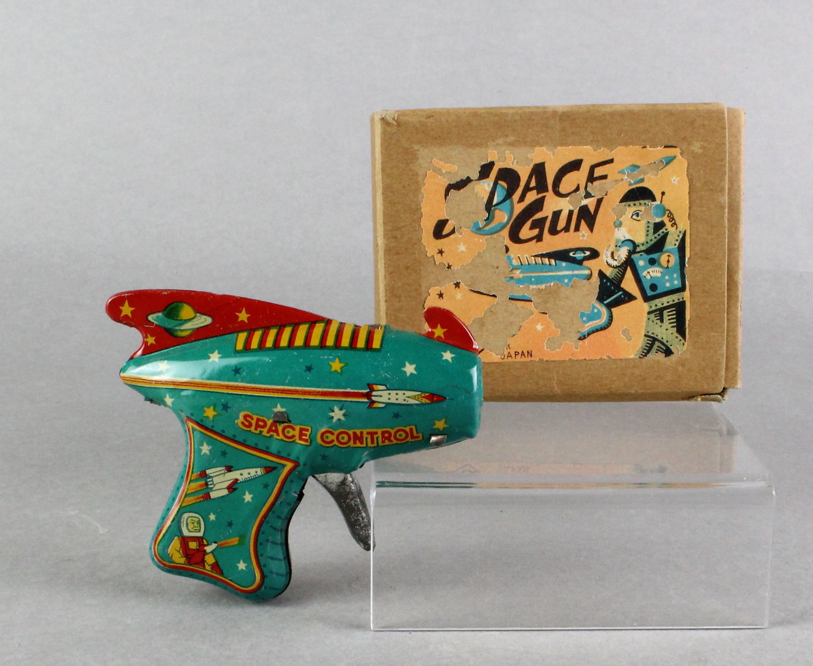 Japan Tin Nomura Space Gun in Box: Japan Tin TN Nomura Space Gun in Box. Raygun with revving noise, no sparks, 4 inches long.