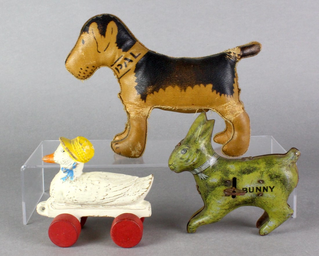 Lindstrom Rabbit, Dog Pal, Duck Pull Toy: Lindstrom Tin Hop Bunny, Stuffed Dog Pal, Duck Wood Pull Toy. Longest 9 1/2 inches.