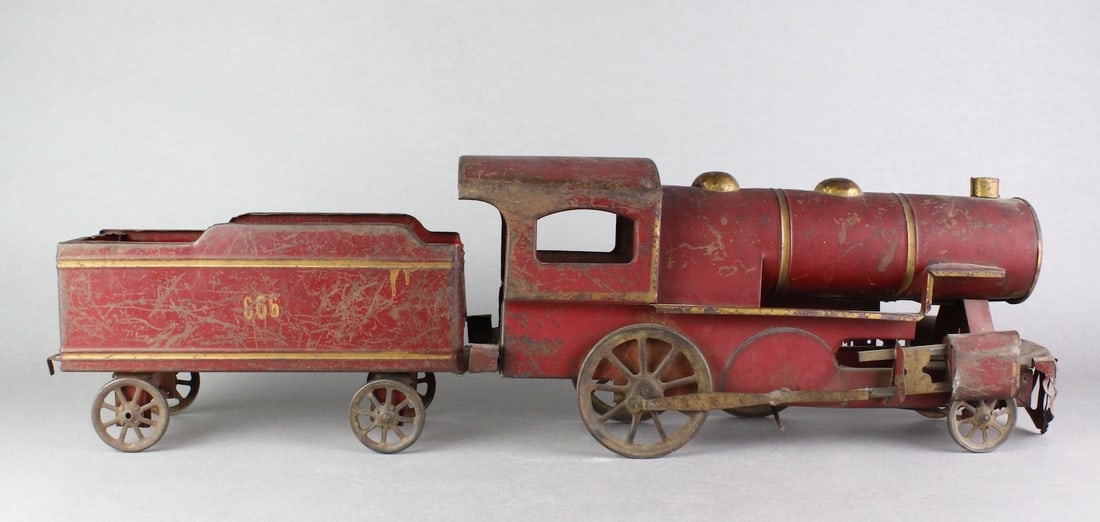 Schieble/Dayton Pressed Steel Locomotive: Schieble/Dayton Pressed Steel Locomotive #666 and tender. 28 1/2 inches long.