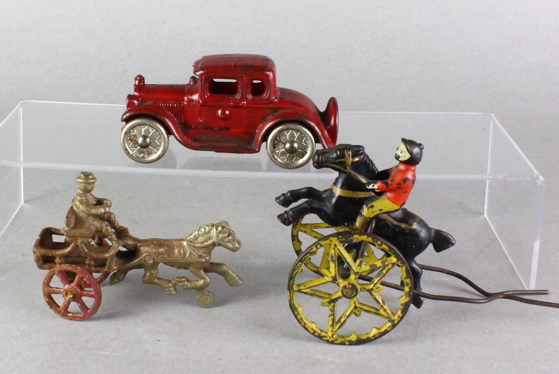 Cast Iron Lot Williams Coupe & Horse Riders: Cast Iron Toy Lot- A.C. Williams Coupe & Horse Riders. Star wheel cart probably went to a wooden push toy, nice paint. Longest 5 inches.