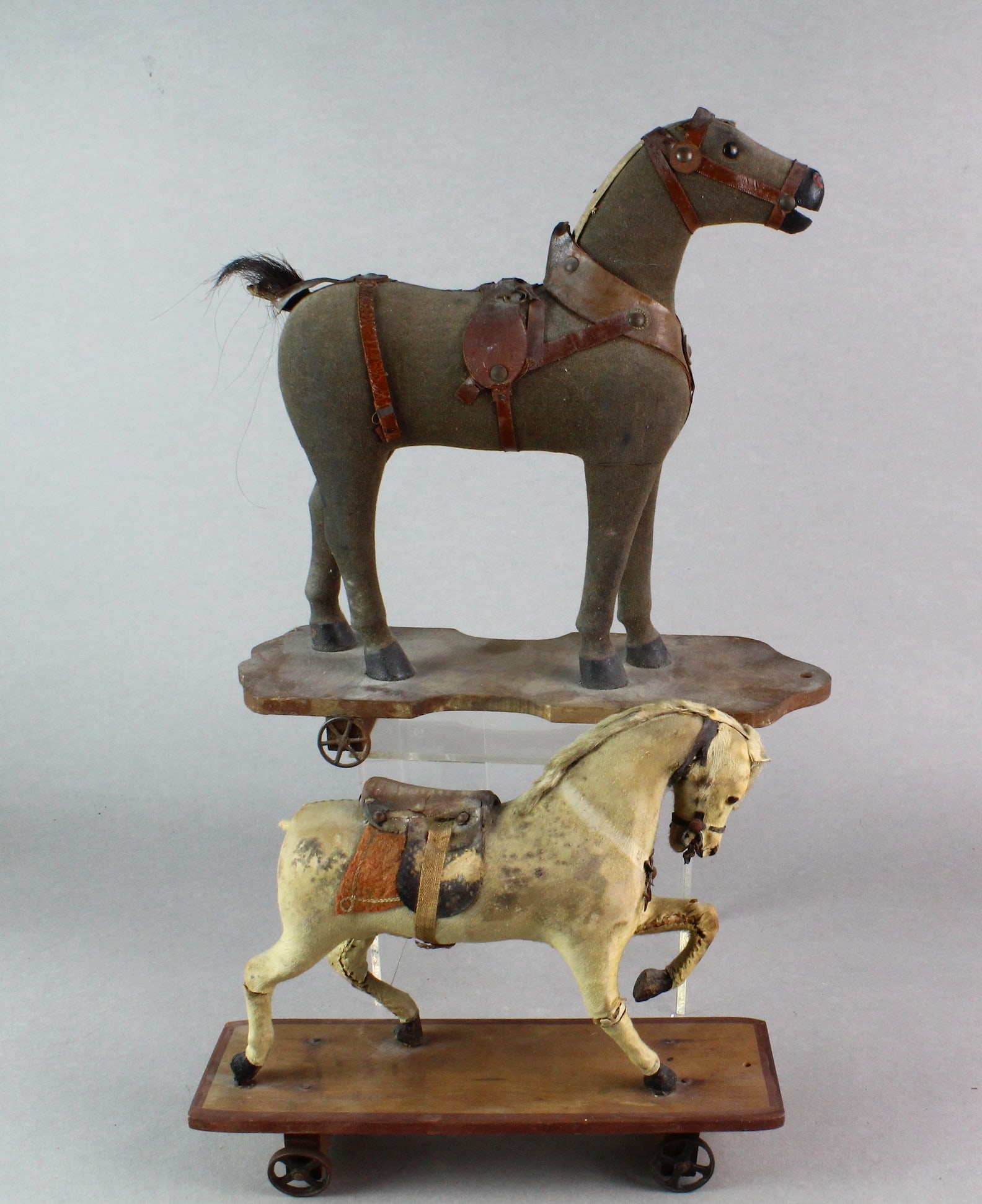 1890s Horse Hide Horse Pull Toys: 1890s-1900s Horse Hide Covered Horse Pull Toys. Original with tackle as shown with wear and some missing pieces. Longest 13 inches.