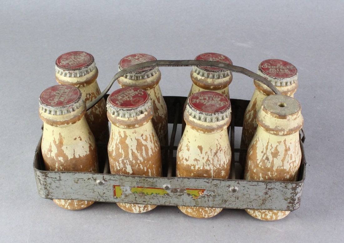 Small Sealtest Milk Bottles with Metal Milk Carrier: Mini Sealtest Milk Bottles in Metal Carrier. 4 Inches tall. One cap missing.