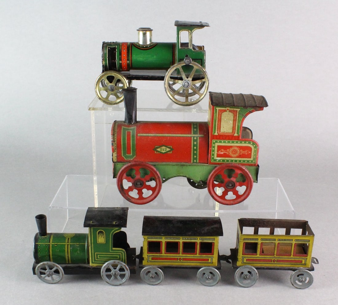 Early German Tin Locomotives: German Tin Locomotives, Engines and cars. Longest Loco 7 inches. Green engine is Flywheel.