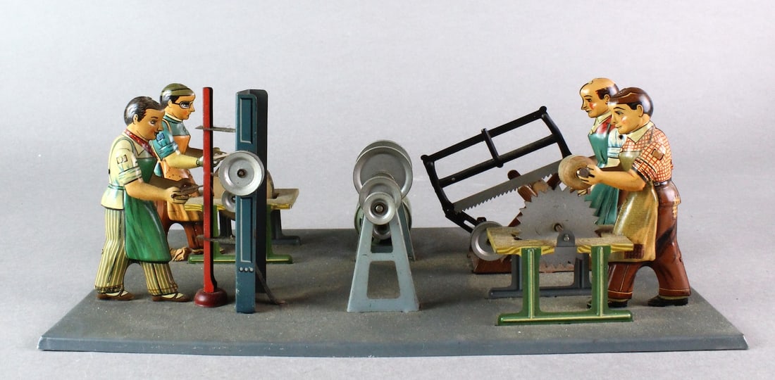 Arnold German Tin Factory Shop with Four Men: Arnold German Tin Factory Shop with Four Men at tool stations. Working crank "engine" creates drive to turn wheels when connected. Platform is 11 1/2 inches wide.