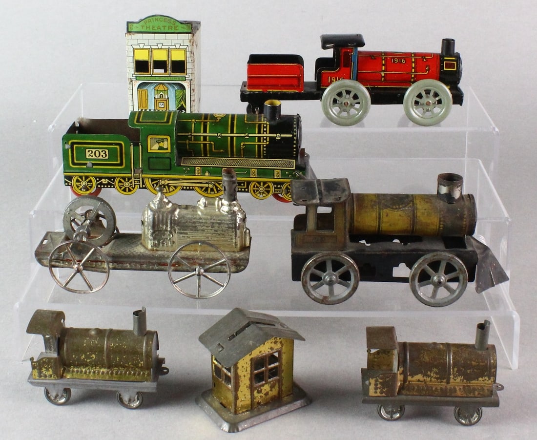 Early Tin Trains, Engines, Buildings: Mostly German tin trains, nice litho and one building has a bank slot. 2 Locomotives with integral tenders. Longest 6 inches.
