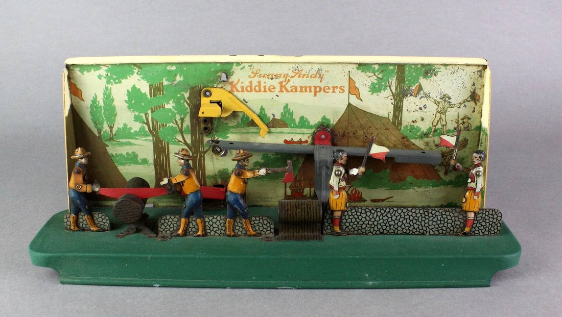 Sunny Andy Kiddie Kampers Tin Toy Scouts: Sunny Andy Kiddie Kampers Tin Toy. Scouts camper set works by dropping marbles down a shute and causing the Scout figures saw a log, chop axe, and wave flags. Clever graphic boy and girl scout toy.