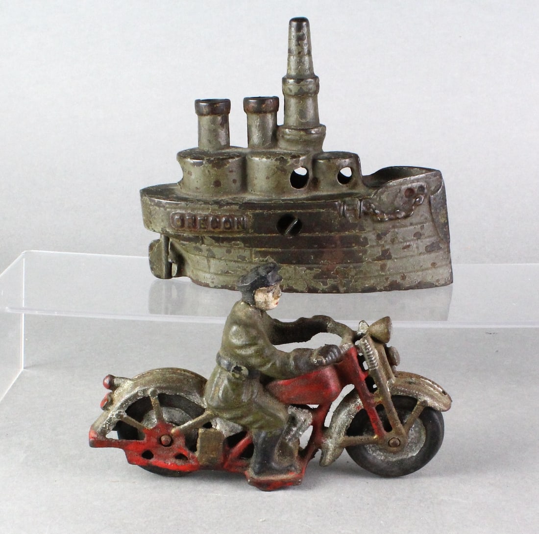 Cast Iron Oregon Battleship Bank & Motorcycle: Stevens Cast Iron Oregon Battleship Bank & Motorcycle. Ship- Original paint, 6 inches long, missing guns. Motorcycle cop appears to be copy of Hubley.