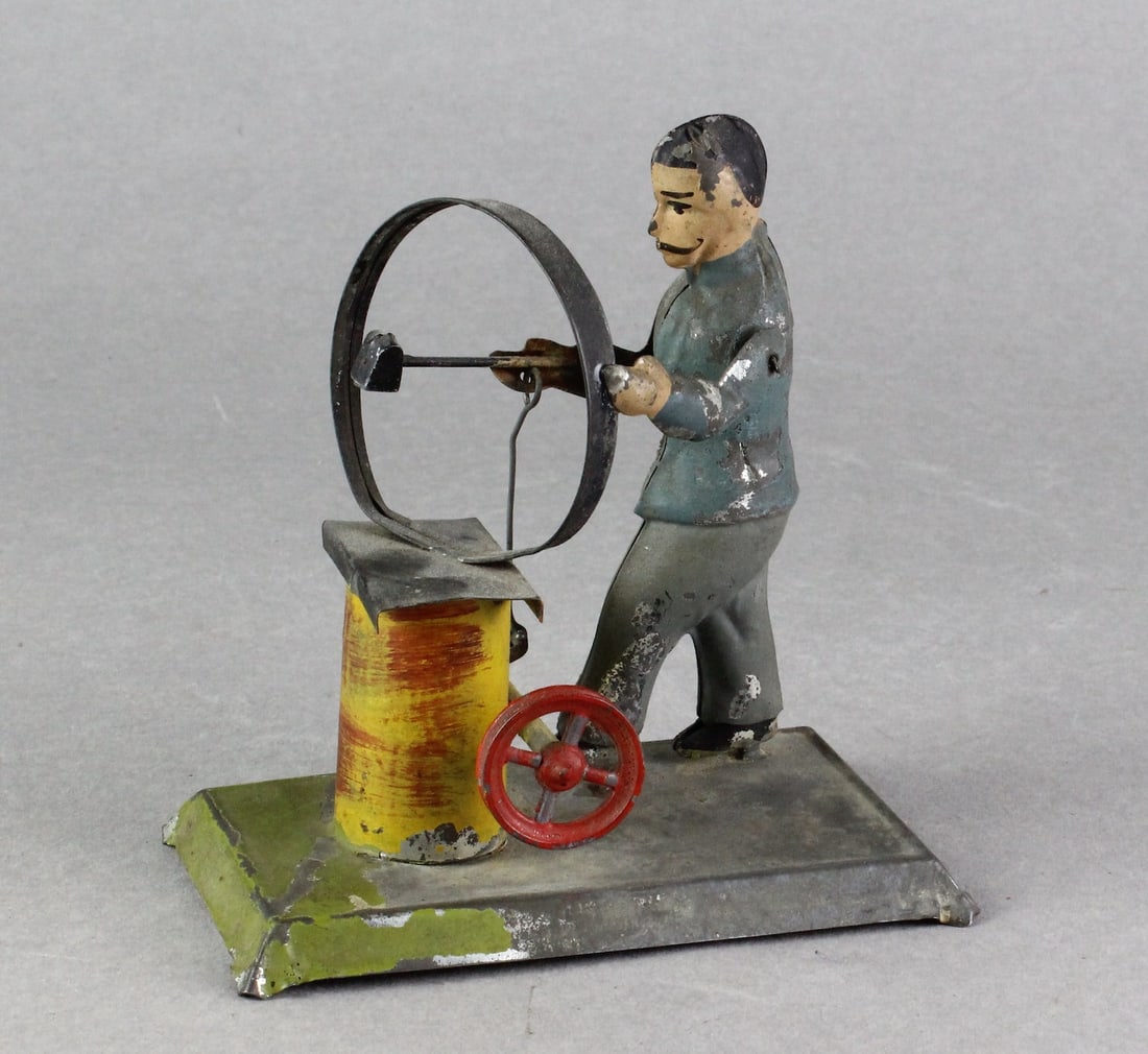 Early Bing Barrel Maker Steam Toy: Early Bing German Tin Barrel Maker Steam Toy. Man hammering hoop for barrels. Hard to find.