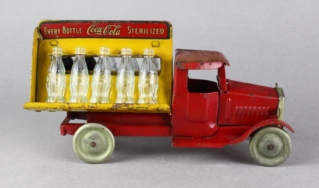 1930s Metalcraft Coca-Cola Truck: 1930s Metalcraft Coca-Cola Truck. Original decals and paint with Coke bottles, 2 filled. 11 1/2 inches long.