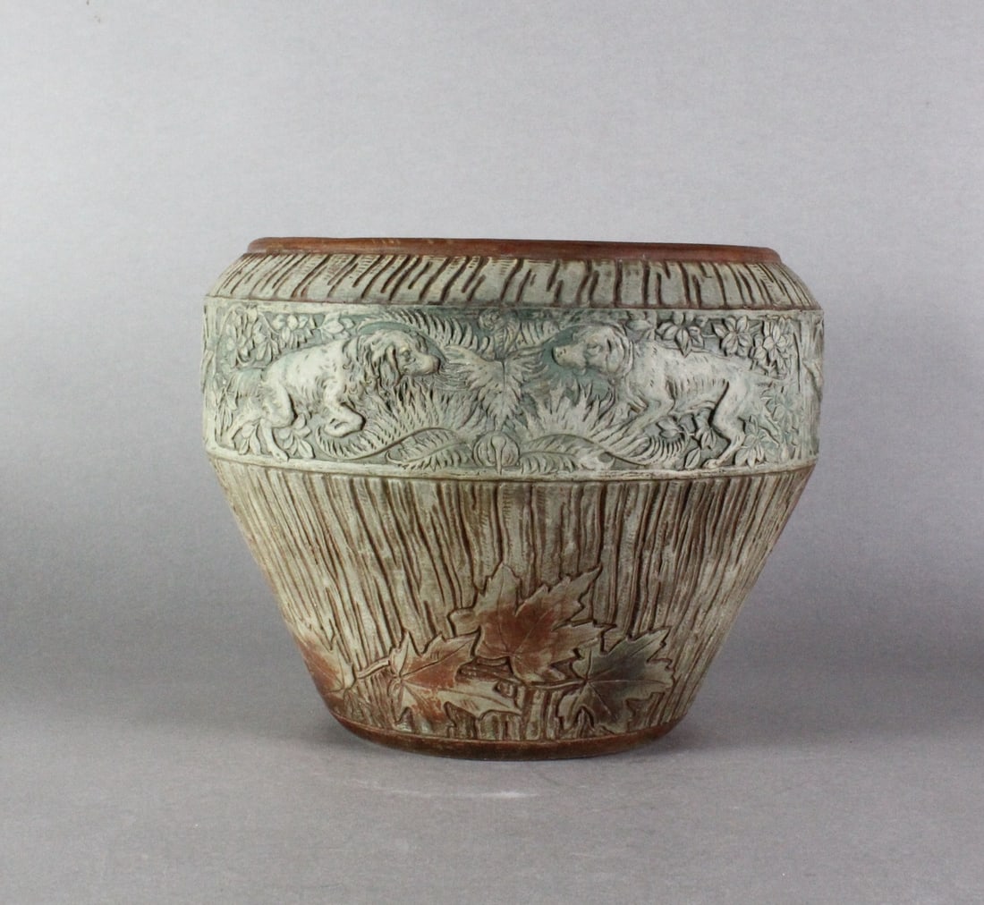 Roseville Pottery Sylvan Jardiniere: Roseville Pottery Sylvan Jardiniere. Scarce, 10 inches tall, hounds and woodland scenes.