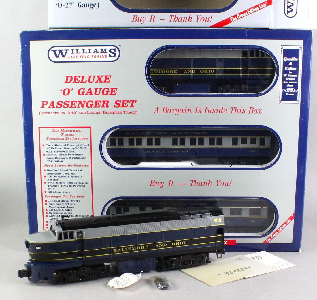 Williams Deluxe B&O Diesel A-A & 4 Madison Cars MINT: Williams Deluxe Twin Motored Power Diesel & 4 Passenger cars- Baggage, 2 Pullman, Observation. B & O Sharknose A-A & 4 Scale Madison Cars (6 total in box). Appear to be near mint to mint in box.