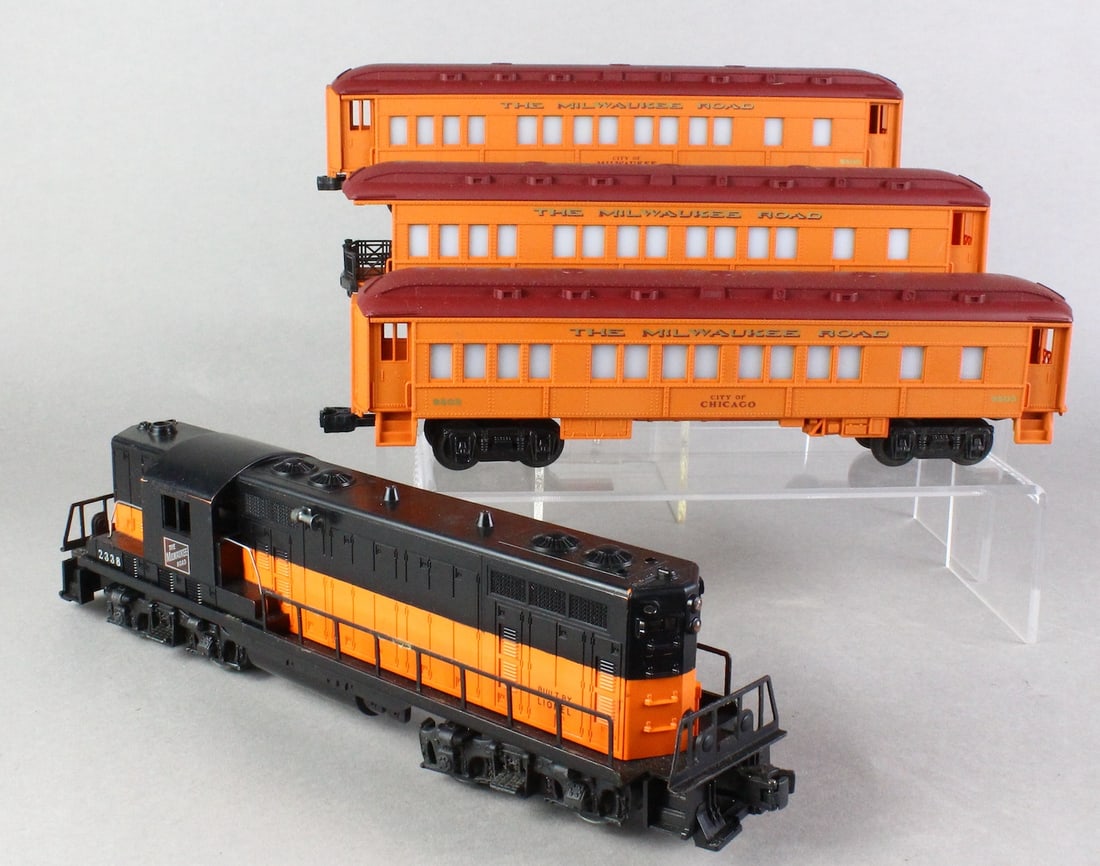 Lionel 2338 Diesel The Milwaukee Road & 3 Cars: Lionel 2338 GP-7 The Milwaukee Road Diesel & The Milwaukee Road passenger cars.