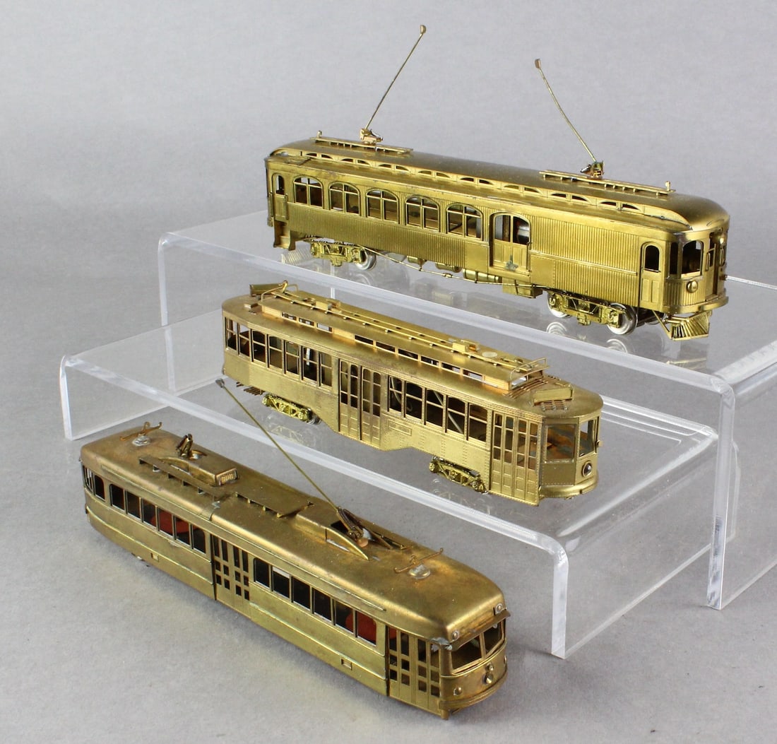 3 Brass HO Trolleys Fairfield, Japan, Orion: 3 Brass HO Trolleys Fairfield Models, and 2 other makers, one possibly Orion, or Suydam. Missing one set of wheels (easy train part) otherwise in very nice shape. Longest 7 1/2 inches long. (No Box)