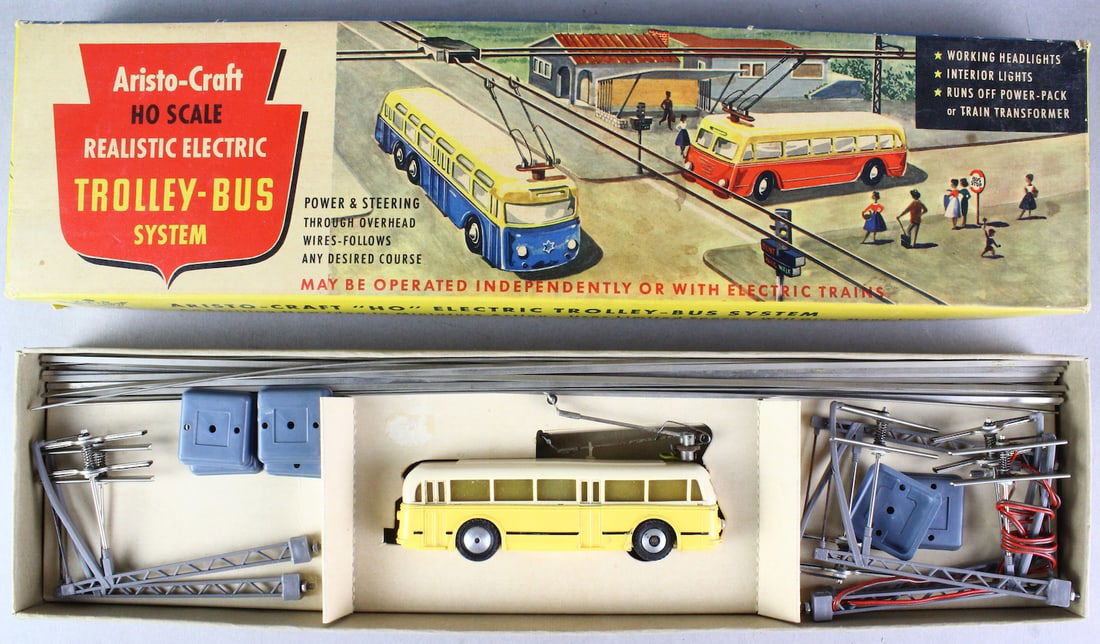 Aristo-Craft HO Trolley System In Box: Aristo-Craft HO Trolley System with Overhead Lines and towers In Box. Made in Germany. Excellent in clean box with instructions. Bus wheels do not turn freely.