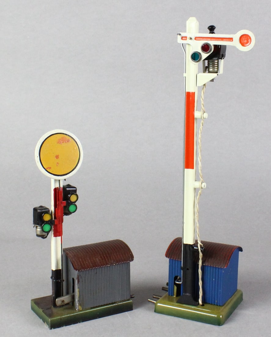 Marklin Signal Shed with Lights: Marklin O or Gauge 1 Signals with Train Shed and lights. Pair of Marklin German signal stations, tallest 11 inches, fine original condition.