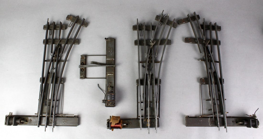 Marklin 1 Gauge 3 Rail Switches with Magneto: Marklin 1 Gauge 3 Rail Switches with Magneto motors. 2 Right Switches, 1 partial with magneto, 1 Left Switch. Sold as shown.